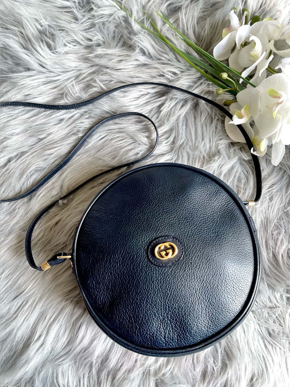 Black Leather Round Crossbody Bag with Gold Accent